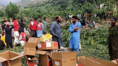 Civil defense workers, locals, and army soldiers prepare to evacuate injured victims of an earthquake in Mazar Dara in Afghanistan's Kunar province after a powerful earthquake claimed several lives and injured many others. (Hedayat Shah/AP)