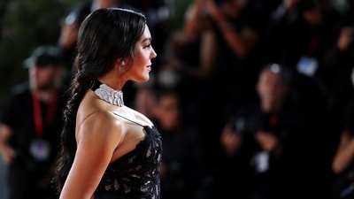 The strappy column gown, featuring a floral lace design and a light train, perfectly hugged her curves.&nbsp; (REUTERS)
