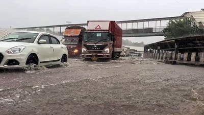Commuters wade through waterlogged road due to heavy rain, in Gurugram on Monday, 1 September. (ANI Video Grab) Commuters wade through waterlogged road due to heavy rain, in Gurugram on Monday, 1 September. (ANI Video Grab)