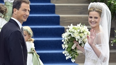 Princess Marie Caroline of Liechtenstein smiled alongside her father as they made their way to the wedding. (Walter Bieri/Keystone via AP) (AP)