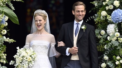 Princess Marie Caroline of Liechtenstein and Leopoldo Maduro Vollmer emerge from the church beaming with joy after their wedding ceremony. (Walter Bieri/Keystone via AP) (AP)