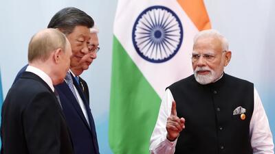 Prime Minister Narendra Modi, Chinese President Xi Jinping, and Russian President Vladimir Putin in conversation at the venue of the Shanghai Cooperation Council (SCO) Summit, in Tianjin on Monday. (DPR PMO) Prime Minister Narendra Modi, Chinese President Xi Jinping, and Russian President Vladimir Putin in conversation at the venue of the Shanghai Cooperation Council (SCO) Summit, in Tianjin on Monday. (DPR PMO)