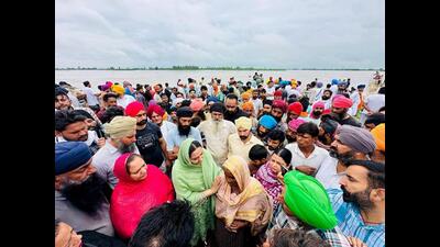 Punjab AAP women wing president Amandeep Kaur Arora meets and distributes relief materials to the families of flood-affected villages in Ferozepur on Monday. (ANI) Punjab AAP women wing president Amandeep Kaur Arora meets and distributes relief materials to the families of flood-affected villages in Ferozepur on Monday. (ANI)