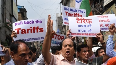 Traders at a protest against the recent tariffs imposed by US President Donald Trump on Indian goods, in New Delhi. (HT File) Traders at a protest against the recent tariffs imposed by US President Donald Trump on Indian goods, in New Delhi. (HT File)