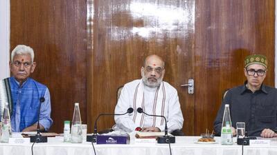 Union home minister Amit Shah, Jammu and Kashmir Lt Governor Manoj Sinha and chief minister Omar Abdullah during a meeting to review the flood situation, at Raj Bhavan, in Jammu on Monday. (PTI Photo) Union home minister Amit Shah, Jammu and Kashmir Lt Governor Manoj Sinha and chief minister Omar Abdullah during a meeting to review the flood situation, at Raj Bhavan, in Jammu on Monday. (PTI Photo)