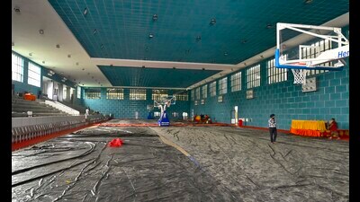 Wet floor of newly built indoor basketball court covered with tarpaulin sheets after Ludhiana witnessed heavy rain on Monday. (Manish/HT) Wet floor of newly built indoor basketball court covered with tarpaulin sheets after Ludhiana witnessed heavy rain on Monday. (Manish/HT)