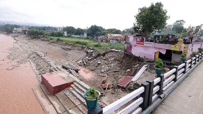 A portion of a temple collapses on the banks of the Tawi River following heavy rains, in Jammu. (Amit Shah- X) A portion of a temple collapses on the banks of the Tawi River following heavy rains, in Jammu. (Amit Shah- X)