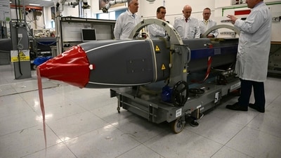 Britain's Defence Secretary John Healey (C) and his French counterpart, Sebastien Lecornu (2L), are shown Storm Shadow missiles during a visit (AFP) Britain's Defence Secretary John Healey (C) and his French counterpart, Sebastien Lecornu (2L), are shown Storm Shadow missiles during a visit (AFP)