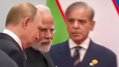 Pakistan Prime Minister Shebaz Sharif (R) was seen in the same frame as PM Modi and Vladimir Putin as they walked past the former at the SCO Summit 2025 in China.&nbsp; (PTI)