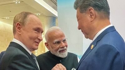 PM Modi, China's Xi Jinping and Russian President Vladimir Putin appeared to be in an impromptu huddle of sorts, sharing some laughs at the SCO Summit. Their bonhomie took centre stage against the backdrop of Trump tariffs.&nbsp; (X/@narendramodi)