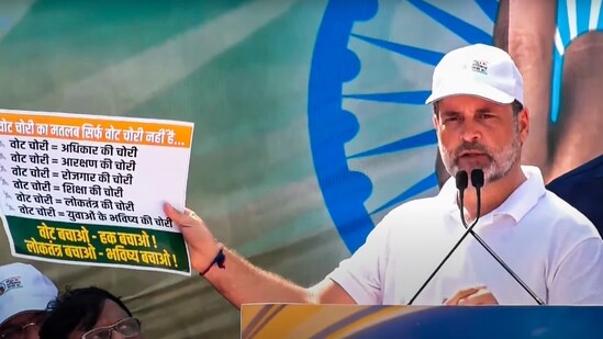 At the culmination of his 'Vote Adhikar Yatra' campaign, in Patna, Rahul Gandhi holds up a sheet to argue that any theft of votes amounts to theft of several basic rights by extension. (@INCIndia)