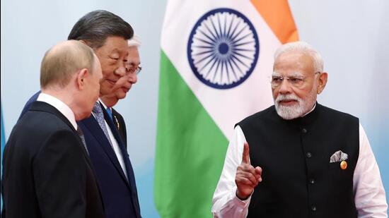 Prime Minister Narendra Modi, Chinese President Xi Jinping, and Russian President Vladimir Putin in conversation at the venue of the Shanghai Cooperation Council (SCO) Summit, in Tianjin on Monday. (DPR PMO)
