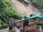 A building under construction collapsing due to a landslide at Anni in Kullu district on Tuesday. There was no casualty. (HT Photo) A building under construction collapsing due to a landslide at Anni in Kullu district on Tuesday. There was no casualty. (HT Photo)