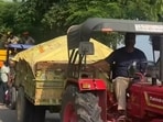 A convoy of tractor-trailers carrying relief material lined up in Kapurthala, one of the worst flood-affected districts of Punjab. (HT Photo) A convoy of tractor-trailers carrying relief material lined up in Kapurthala, one of the worst flood-affected districts of Punjab. (HT Photo)
