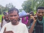 A video of the incident, shared widely on social media, shows four men walking along a road carrying woman’s body on a cot. (Video grab) A video of the incident, shared widely on social media, shows four men walking along a road carrying woman’s body on a cot. (Video grab)