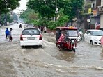 Commuters traversing a waterlogged stretch near Shingar Cinema in Ludhiana on Monday. (Gurpreet Singh/HT) Commuters traversing a waterlogged stretch near Shingar Cinema in Ludhiana on Monday. (Gurpreet Singh/HT)