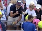 Polish CEO Piotr Szczerek was caught swiping an autographed hat from a child at the US Open. Polish CEO Piotr Szczerek was caught swiping an autographed hat from a child at the US Open.