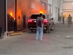 A Dubai influencer shared how his parked Maybach suddenly caught fire. A Dubai influencer shared how his parked Maybach suddenly caught fire.