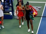 Venus Williams (USA) (R) and partner Leylah Fernandez (CAN) (L) leave the court after their match against Katerina Siniakova (CZE) and Taylor Townsend (USA) 