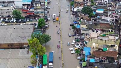 A drone visual of the large part of Gurugram reeling under a waterlogged road on Tuesday. (ANI) A drone visual of the large part of Gurugram reeling under a waterlogged road on Tuesday. (ANI)