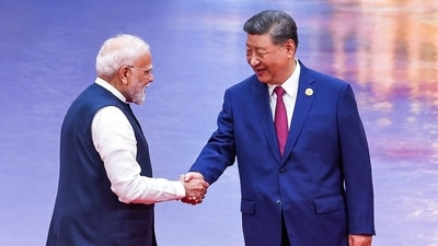 Prime Minister Narendra Modi (L) and China's President Xi Jinping shake hands during the welcoming ceremony of the Shanghai Cooperation Organization (SCO) summit in Tianjin. (AFP)