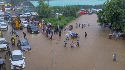 Commuters wade through a waterlogged road amid heavy rainfall in Gurugram. (PTI) (HT_PRINT) Commuters wade through a waterlogged road amid heavy rainfall in Gurugram. (PTI) (HT_PRINT)