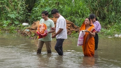 The Yamuna River level has risen and crossed the danger mark after incessant heavy rainfall. But that didn't come as an obstacle to devotion. A man carrying an idol of Lord Ganesh makes his way near Loha Pul (Old Iron Bridge) in New Delhi. (PTI) The Yamuna River level has risen and crossed the danger mark after incessant heavy rainfall. But that didn't come as an obstacle to devotion. A man carrying an idol of Lord Ganesh makes his way near Loha Pul (Old Iron Bridge) in New Delhi. (PTI)