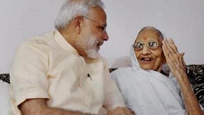 File photo of Prime Minister Narendra Modi spending time with his mother on his birthday at her Gandhinagar residence. (PTI) File photo of Prime Minister Narendra Modi spending time with his mother on his birthday at her Gandhinagar residence. (PTI)