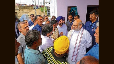 Home Minister Amit Shah who visited Jammu to assess the flood damages chaired a review meeting in Jammu. In one of the review meetings held on Monday both J&K chief minister Omar Abdullah and Lt Governor Manoj Sinha and top officials were present. (PTI File) Home Minister Amit Shah who visited Jammu to assess the flood damages chaired a review meeting in Jammu. In one of the review meetings held on Monday both J&K chief minister Omar Abdullah and Lt Governor Manoj Sinha and top officials were present. (PTI File)