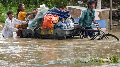 The Delhi NCR region has been witnessing heavy rainfall since Monday, which has disrupted the daily lives of the Delhi NCR residents. On Tuesday, people made their way through the waterlogging due to incessant heavy rainfall in New Delhi. (PTI) The Delhi NCR region has been witnessing heavy rainfall since Monday, which has disrupted the daily lives of the Delhi NCR residents. On Tuesday, people made their way through the waterlogging due to incessant heavy rainfall in New Delhi. (PTI)