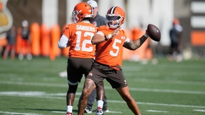 Cleveland Browns quarterback Shedeur Sanders (12 and quarterback Dillon Gabriel (5) throw during a practice (AP)