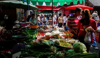 People shop at a market in Bangkok, Thailand, August 24, 2025. (REUTERS) People shop at a market in Bangkok, Thailand, August 24, 2025. (REUTERS)