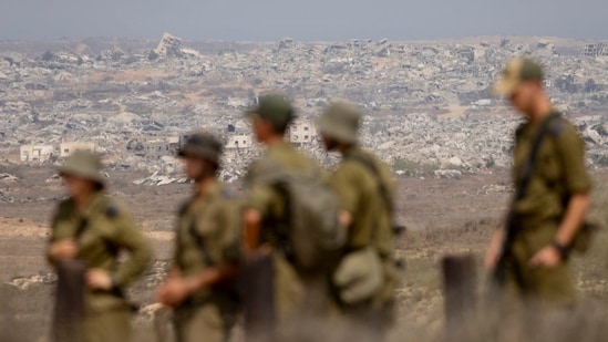 Israeli soldiers overlooking destroyed buildings in the northern Gaza Strip last month.