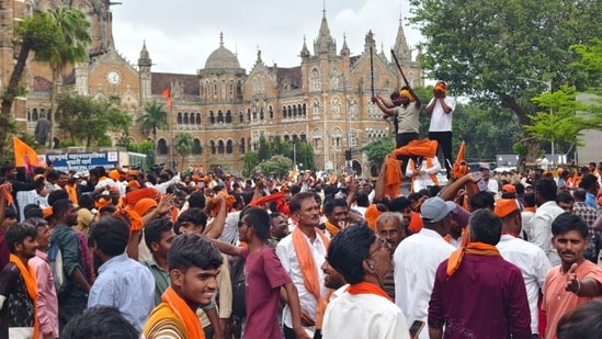 Protesters seeking quota for the Marathas celebrate at the iconic Chhatrapati Shivaji Maharaj Terminus in Mumbai on Tuesday, after their leader, Manoj Jarange-Patil, announced that the government has accepted their demands. (Raju Shinde/HT Photo)