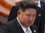 North Korea's leader Kim Jong Un walks after taking a group photograph during a military parade marking the 80th anniversary of victory over Japan and the end of World War II. North Korea's leader Kim Jong Un walks after taking a group photograph during a military parade marking the 80th anniversary of victory over Japan and the end of World War II.
