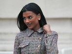Simone Ashley stuns in Chanel, wearing a multicoloured plaid jacket and a mini skirt.