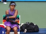 Japan's Naomi Osaka during her round of 16 match against Coco Gauff of the U.S. as her Labubu doll is seen