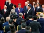 Chinese President Xi Jinping, Russian President Vladimir Putin and North Korean leader Kim Jong Un arrive for a reception