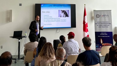A police officer specialising in hate crimes interfacing with members of the Hindu community in Montreal in late August. (Credit: CoHNA Canada) A police officer specialising in hate crimes interfacing with members of the Hindu community in Montreal in late August. (Credit: CoHNA Canada)