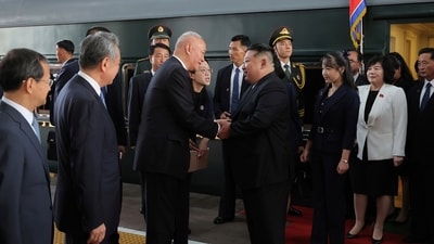 Kim's daughter, believed to be identified as Ju Ae, was seen standing behind him upon their arrival in Beijing. (KCNA/AP) Kim's daughter, believed to be identified as Ju Ae, was seen standing behind him upon their arrival in Beijing. (KCNA/AP)