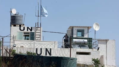 A U.N. peacekeeper of the United Nations Interim Force in Lebanon (UNIFIL) stands at his post in the village of Markaba, near the border with Israel, southern Lebanon, (REUTERS)