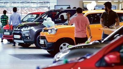 File photo of Maruti Suzuki cars inside a showroom.