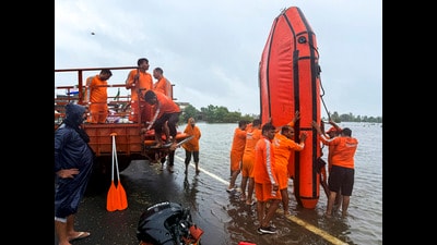 NDRF personnel prepare to patrol a flooded area at Gaggo Mahal village, near Amritsar on Wednesday. (PTI)