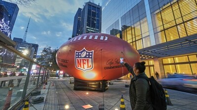 A fan takes a picture of an American football installation on Paulista Avenue ahead of Chiefs vs Chargers (AP) A fan takes a picture of an American football installation on Paulista Avenue ahead of Chiefs vs Chargers (AP)