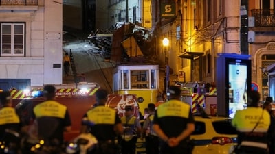 Police officers look at the wreckage of the Lisbon's Gloria funicular railway car that derailed and crashed, resulting in fatalities and injuries, in Lisbon, Portugal, September 3, 2025. (REUTERS)