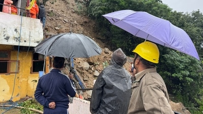 People look at the debris scattered around during a search and rescue operation, after a landslide-hit the Inner Akhara Bazaar area on Tuesday, in Kullu (PTI) People look at the debris scattered around during a search and rescue operation, after a landslide-hit the Inner Akhara Bazaar area on Tuesday, in Kullu (PTI)