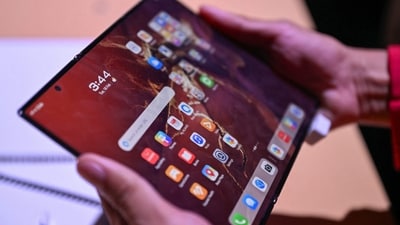 Samsung Galaxy Z Tri Fold may launch in selected markets this month.
(Representative image) (AFP) Samsung Galaxy Z Tri Fold may launch in selected markets this month.
(Representative image) (AFP)