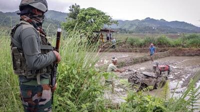Security personnel stands guard during the farming season to prevent any untoward incidents in Imphal in July (ANI) Security personnel stands guard during the farming season to prevent any untoward incidents in Imphal in July (ANI)