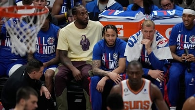 Los Angeles Clippers' Kawhi Leonard, in yellow, sits on the bench (AP) Los Angeles Clippers' Kawhi Leonard, in yellow, sits on the bench (AP)