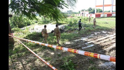 The area where an explosion took place in a pit dug to dump gunpowder recovered during raids after the Sunday’s explosion in Behta (Deepak Gupta/HT) The area where an explosion took place in a pit dug to dump gunpowder recovered during raids after the Sunday’s explosion in Behta (Deepak Gupta/HT)